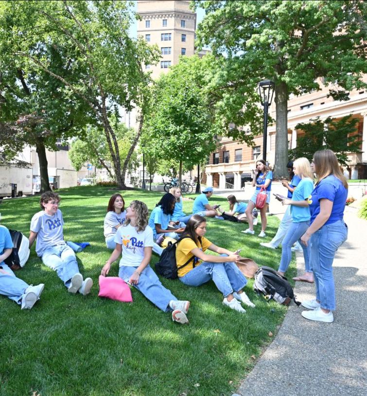 Students sitting in the grass